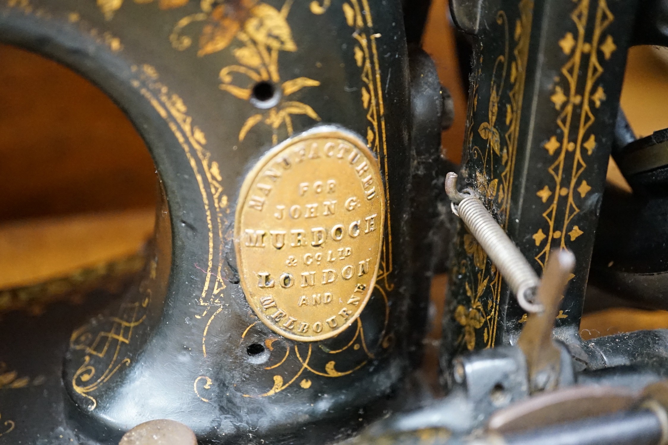 A 19th century mother of pearl decorated John Murdoch sewing machine with wooden case